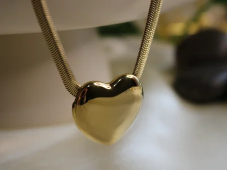 heart shaped gold plated pendant with herringbone textured chain