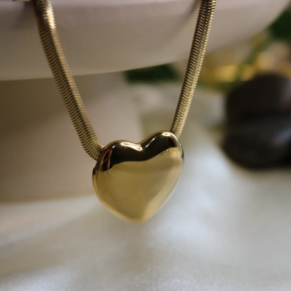 heart shaped gold plated pendant with herringbone textured chain